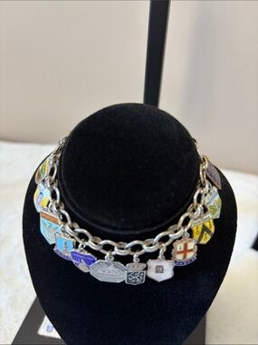 Vintage Swiss Charm Bracelet. Many marked sterling / silver